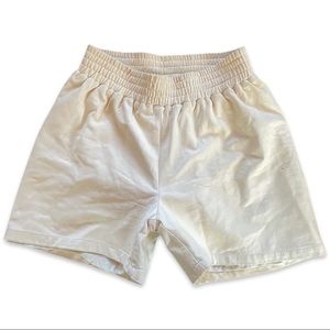 Cream colored leather athletic shorts